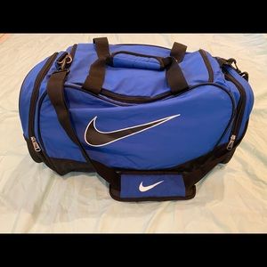 Large blue Nike duffel bag.